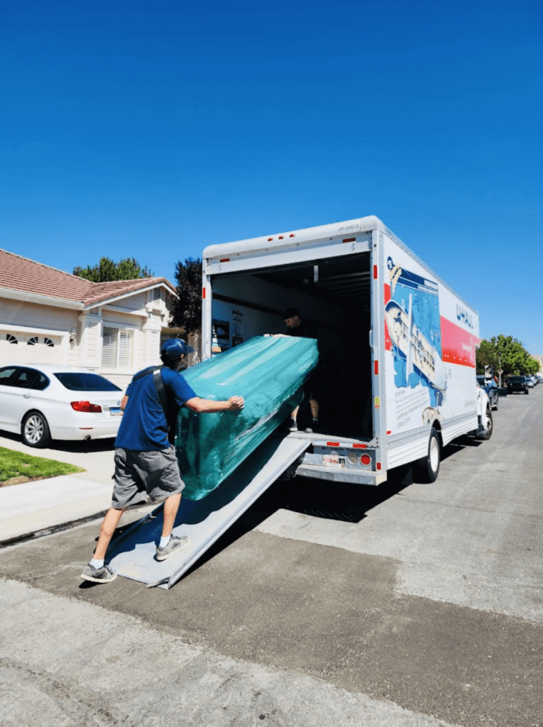 Reno Tahoe movers carefully loading furniture into a moving truck